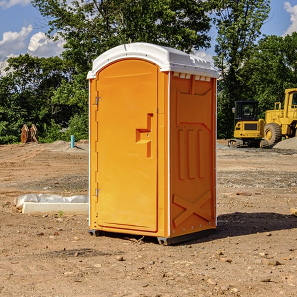 what is the cost difference between standard and deluxe portable restroom rentals in Brownlee